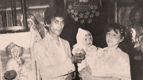 Maria with her parents at a baptism in a local Romanian church.