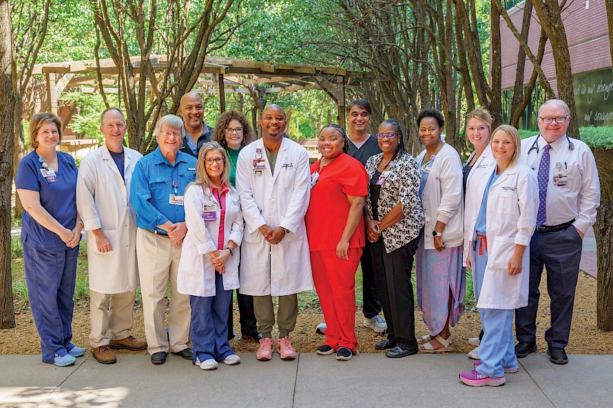 Members of the Tumor Board gather for bimonthly meetings at CHRISTUS St. Michael Hospital. (L-R) Jessica Smallwood, Dr. Malcolm Smith, Dr. Bryan Griffin, Dr. Reginald Baptiste, Yolanda Bone, Charlotte McKamie, Dr. Charles Matthews, Dr. Daphne Taylor, Dr. Sunil Patel,  Jowana Billingly, Lakecia Washington, Brandy Smith, Dr. Beth Peterson, and Dr. Gary Engstrom. photo by Matt Cornelius